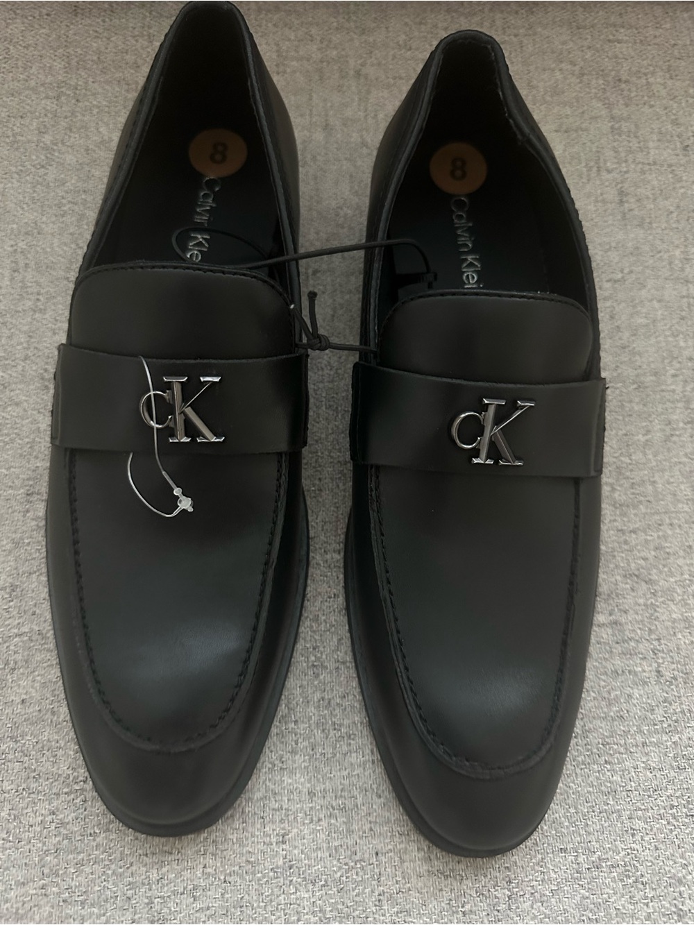 Calvin Klein Black Leather Penny Loafers with Silver CK Emblem